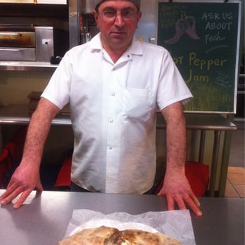 Pizza Buono - John petraccione in front of his calzone masterpiece - Juice Bars & Smoothies Near Me - Schenectady, New York