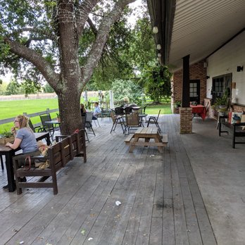 The Wheel Kitchen - Beautiful patio under huge oaks, definitely a destination in nice weather. - Cafes Near Me - Tomball, Texas The Wheel Kitchen - Beautiful patio under huge oaks, definitely a destination in nice weather. - Cafes Near Me - Tomball, Texas