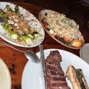 Manuela - Bone marrow NY strip steak, grilled asparagus and potatoes - New American Near Me - Los Angeles, California Manuela - Bone marrow NY strip steak, grilled asparagus and potatoes - New American Near Me - Los Angeles, California