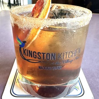 Kingston Kitchen - Banana Old Fashioned with brown sugar rum and candied blood orange garnish. - Caribbean Near Me - St. Ignace, Michigan