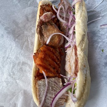 Olenka Peruvian Bistro - Pan con Chicharron Sandwich inside - Bakeries Near Me - Weston, Florida