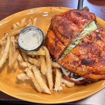 Taqueria La Fuente - Torta covered in enchilada sauce then seared. - Mexican Near Me - Tigard, Oregon Taqueria La Fuente - Torta covered in enchilada sauce then seared. - Mexican Near Me - Tigard, Oregon