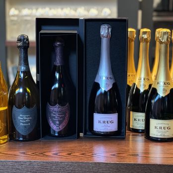 Creston - a selection of sparkling wines in a display case - Wine Bars Near Me - New York, New York