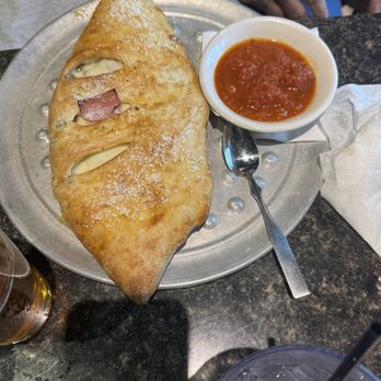 Piesanos Stone Fired Pizza - Windermere - Meat Eater Calzone - Italian Near Me - Windermere, Florida Piesanos Stone Fired Pizza - Windermere - Meat Eater Calzone - Italian Near Me - Windermere, Florida