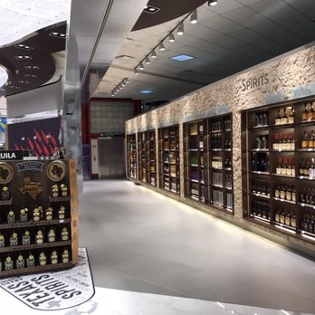 American Express Centurion Lounge - At the far end of the liquor section is the elevator you want! - Airport Lounges Near Me - Houston, Texas American Express Centurion Lounge - At the far end of the liquor section is the elevator you want! - Airport Lounges Near Me - Houston, Texas