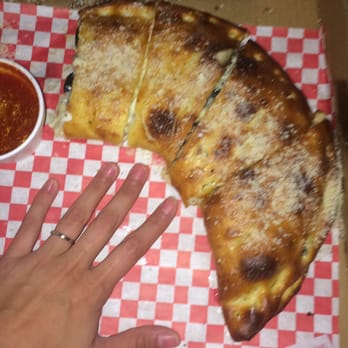 Marri's Pizza & Pasta - Small (minus one piece) with my hand for comparison. - Italian Near Me - Orange, California