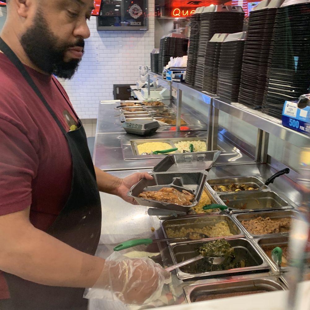 Who's Got Soul Southern Grill Duluth - Prep station with sides. Scooping the delicious greens. - Soul Food Near Me - Duluth, Georgia Who's Got Soul Southern Grill Duluth - Prep station with sides. Scooping the delicious greens. - Soul Food Near Me - Duluth, Georgia
