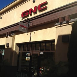 the front of a restaurant with a bicycle parked outside the front of a restaurant with a bicycle parked outside
