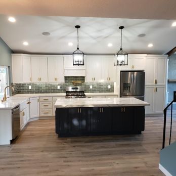 Burns Construction - a kitchen with white cabinets and wood floors - General Contractors Near Me - Carmichael, California