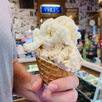 Scarlet Scoop Ice Cream Parlor - a man holding a cone of ice cream - Ice Cream & Frozen Yogurt Near Me - Houma, Louisiana Scarlet Scoop Ice Cream Parlor - a man holding a cone of ice cream - Ice Cream & Frozen Yogurt Near Me - Houma, Louisiana