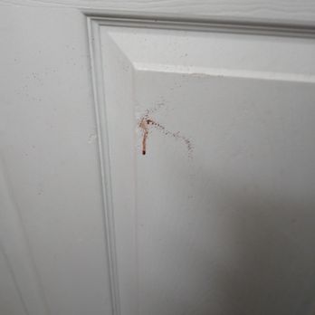 Key West Inn - Roanoke - Dried blood on bathroom door - Hotels Near Me - Roanoke, Alabama