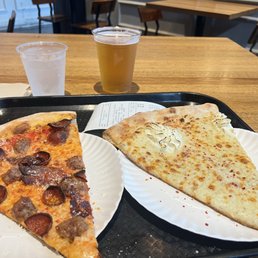 Meat lovers and white pizza slices Meat lovers and white pizza slices