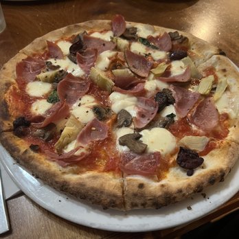 Pacci's Trattoria & Pasticceria - Capricciosa pizza. Ham, olives, artichokes, mushrooms, and basil. Lovely crust with a nice chew, and a yeasty, slightly fermented flavor. - Italian Near Me - Silver Spring, Maryland Pacci's Trattoria & Pasticceria - Capricciosa pizza. Ham, olives, artichokes, mushrooms, and basil. Lovely crust with a nice chew, and a yeasty, slightly fermented flavor. - Italian Near Me - Silver Spring, Maryland