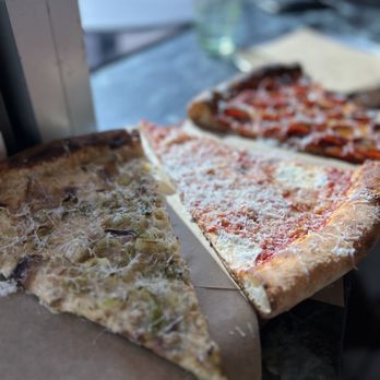 Miami Slice - two slices of pizza on a table - Pizza Near Me - Miami, Florida Miami Slice - two slices of pizza on a table - Pizza Near Me - Miami, Florida