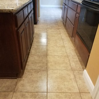 Julian Flooring - After old wood rip up and replace with new tile.. - Flooring Near Me - Pflugerville, Texas