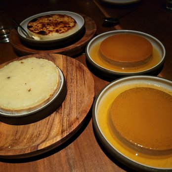Bar Moro - Basque Cheesecake (Top), Award-Winning Spanish Cheese (Left), and 2 Flans (Right) - Spanish Near Me - Clayton, Missouri Bar Moro - Basque Cheesecake (Top), Award-Winning Spanish Cheese (Left), and 2 Flans (Right) - Spanish Near Me - Clayton, Missouri