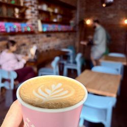 Handmade whole milk latte with latte art.