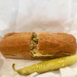 Capra's Italian Deli - 8" Roast Beef & Swiss on toasted Wheat sub bread, dill pickle slice, Utz potato chips