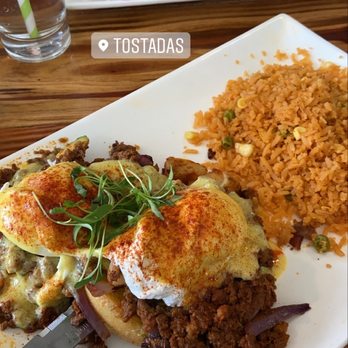 Tostadas - mexican eggs benedict w/ chilaquiles in the background - Breakfast & Brunch Near Me - San Jose, California