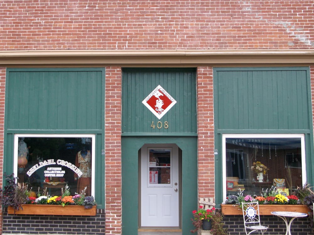 Sheldahl Crossing Logo