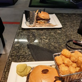 Topgolf - 2 black bean burgers one with tots and one with fries - Sports Bars Near Me - Spring, Texas Topgolf - 2 black bean burgers one with tots and one with fries - Sports Bars Near Me - Spring, Texas
