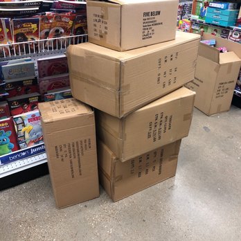 Five Below - Random boxes not yet stocked. Easy way to trip over if not paying attention - Discount Store Near Me - Stafford, Texas