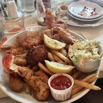 Matt's Fish Camp Lewes - Absolutely delicious fish combo. Lobster tail, huge scallops, cod fish, shrimp, and two crab cakes over perfect fries. - Seafood Near Me - Lewes, Delaware Matt's Fish Camp Lewes - Absolutely delicious fish combo. Lobster tail, huge scallops, cod fish, shrimp, and two crab cakes over perfect fries. - Seafood Near Me - Lewes, Delaware