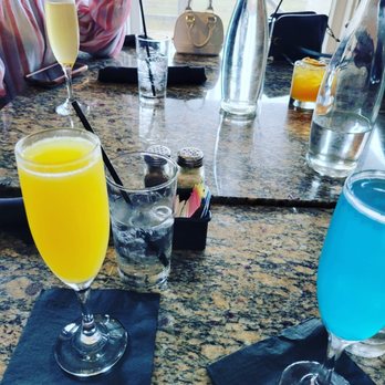 Lucille's - Original mimosa in the front peach mimosa in the back! - New American Near Me - Houston, Texas Lucille's - Original mimosa in the front peach mimosa in the back! - New American Near Me - Houston, Texas
