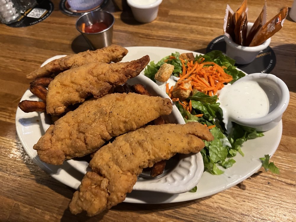 Chicken strips, sweet potato fries and side salad Yelp