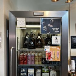 Beanstock Coffee Roasters - Cold brews for sale and creamers for the complimentary coffee.