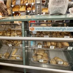 BreadWorks - Display case of salt sticks, baguettes, wheat rolls, etc.