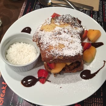 Clafoutis - French toast, with coconut on the side - French Near Me - Santa Fe, New Mexico Clafoutis - French toast, with coconut on the side - French Near Me - Santa Fe, New Mexico