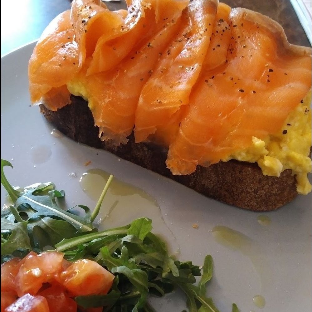 Dolce Sicily - Salmon-topped scrambled eggs on toast with side salad. - Italian Near Me - Dublin, D Dolce Sicily - Salmon-topped scrambled eggs on toast with side salad. - Italian Near Me - Dublin, D