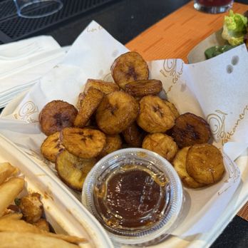 Paradita Eatery - Fried plantains (platanos) with a sweet syrup sauce for dipping. - Peruvian Near Me - Emeryville, California Paradita Eatery - Fried plantains (platanos) with a sweet syrup sauce for dipping. - Peruvian Near Me - Emeryville, California