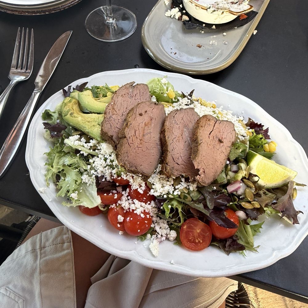 Hill & Vine - Avocado lime salad with tri tip - Cocktail Bars Near Me - Fredericksburg, Texas