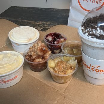 Peach Cobbler Factory - Flight with strawberry, blackberry, honey apple, and caramel apple - Desserts Near Me - Huntington, West Virginia Peach Cobbler Factory - Flight with strawberry, blackberry, honey apple, and caramel apple - Desserts Near Me - Huntington, West Virginia