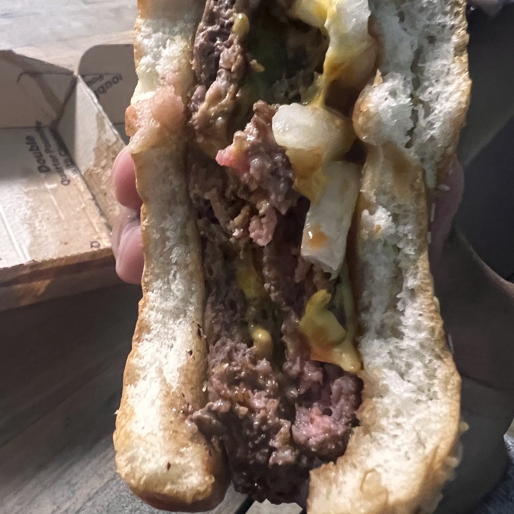a person holding a hot dog a person holding a hot dog