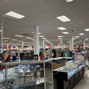 TJ Maxx - Jewel refines I always a nice stop. - A jewelry display case with various jewelry items is situated inside a retail store, illuminated by ceiling fluorescent lights. - Department Stores Near Me - Poughkeepsie, New York