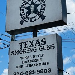 Texas Smoking Guns - Outside sign