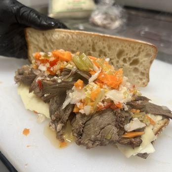 Il Taglio - THE MANZO. Slow-braised shaved beef with sharp provolone, giardiniera, and au jus on the side. - Salad Near Me - Fort Lauderdale, Florida Il Taglio - THE MANZO. Slow-braised shaved beef with sharp provolone, giardiniera, and au jus on the side. - Salad Near Me - Fort Lauderdale, Florida