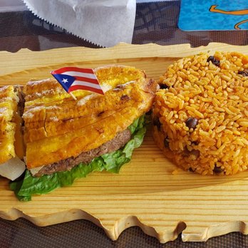 Cuisine De Jibarito - Steak jibarito ($9.50), a garlic fried plantain sandwich w/lettuce, cheese, tomato and mayo. Served with arroz con gandules! - Puerto Rican Near Me - Melrose Park, Illinois