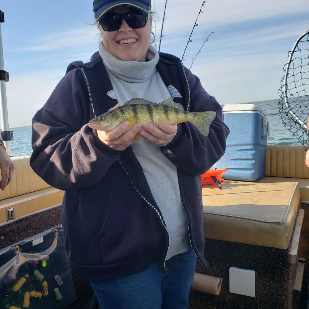 Thumbs Up Charter Services - Daughter Andrea with a very nice perch - Fishing Near Me - Bay Port, Michigan Thumbs Up Charter Services - Daughter Andrea with a very nice perch - Fishing Near Me - Bay Port, Michigan