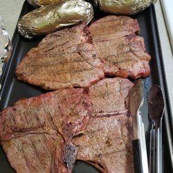 Massey's Meat Market - T-Bone Steak with baked potatoes  ( cooked at home)