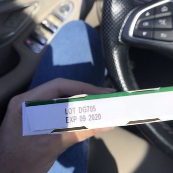 Albertsons - a hand holding a box of pizza - Grocery Near Me - Ladera Ranch, California