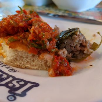 Istanbul Grill - Stuffed grape leaves and tomato and pepper salad on fresh bread - Turkish Near Me - Houston, Texas Istanbul Grill - Stuffed grape leaves and tomato and pepper salad on fresh bread - Turkish Near Me - Houston, Texas