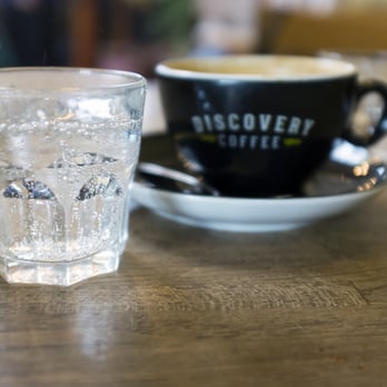 Discovery Coffee - a glass of water and a cup of coffee - Coffee & Tea Near Me - Victoria, British Columbia
