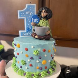 Marcia’s Bakery - Encanto/Bruno themed smash cake. Marcia worked with me to match the vibe of the movie in colors and the figure we had.