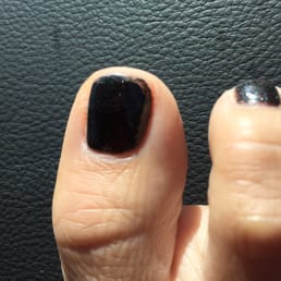 Second coat did not cover to the edge of nail nor did she sweep the brush parallel to my nail edge.