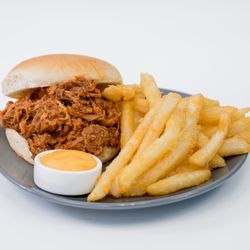Our classic Pulled Pork sandwich with an order of our cheese fries!