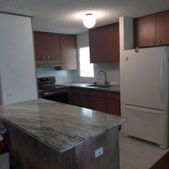DL builder - a kitchen with a refrigerator, sink, and stove - General Contractors Near Me - Kaneohe, Hawaii